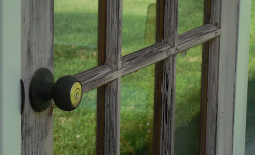 Doorknob on glass door leading outside